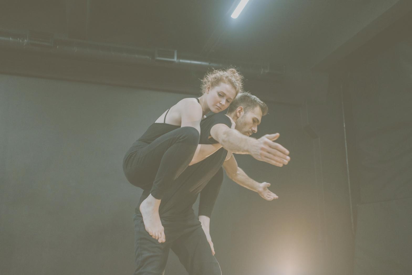 Contemporary dance movement captured in expressive black and white photography